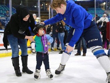 Newcomers Zena Salman and her daughter Dalia Salman take to the ice for the first time with the Saskatoon Blades during their "Welcome the World" event at SaskTel Centre, January 22, 2017.