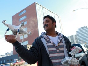 Nawidullah Shirzai holds up his drone which he flies to make breathtaking aerial footage of Saskatoon. Once operating illegally, he says he now directs other rogue drone operators to information that will help them operate safely and legally.