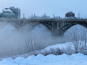 Steam rises from the South Saskatchewan River under the Broadway Bridge.