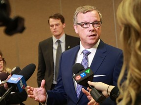 Saskatchewan Premier Brad Wall (front) and Saskatoon Mayor Charlie Clark held a news conference at TCU Place in Saskatoon on January 30, 2017