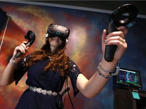 SASKATOON, SK - January 31, 2017 - Aspect VR's owner Jessica Engele demonstrates the Vive game "Tilt Brush" where she can paint a 3D world around her at her virtual reality gaming business located at 2218 Millar Avenue in Saskatoon on January 31, 2017. (Michelle Berg / Saskatoon StarPhoenix)