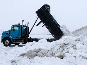 A truck empties snow in the newly opened Snow Management Facility on Valley Road in Saskatoon on January 9, 2017. (Michelle Berg / Saskatoon StarPhoenix)