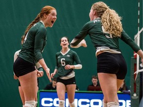 University of Saskatchewan Huskies women's volleyball setter Mackenzie Pek, #14, celebrates with teammates against the University of Manitoba Bisons during U Sports women's volleyball action in Saskatoon.