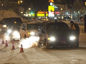 Saskatoon police stop drivers at a check stop in this December 2007 file photo. (GREG PENDER/The StarPhoenix)