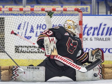 Calgary Hitmen goalie Kyle Dumba makes a pad save against the Saskatoon Blades during overtime in WHL action in Saskatoon, January 10, 2017. The Blades defeat the Hitmen in overtime 5-4.