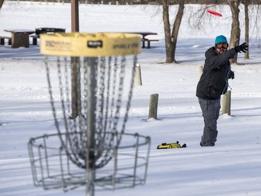 Casey Murray plays a round of disc golf at Diefenbaker Park in Saskatoon, January 12, 2017. Murray didn't seem to be bothered by the extremely low temperature.