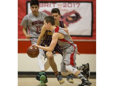 Bedford Road RedHawks guard Quinten Reichel moves the ball against the Dr. Martin Leboldus Suns during first quarter action of the opening game of the Bedford Road Invitational Tournament (BRIT) at Bedford Road Collegiate in Saskatoon, January 12, 2017.