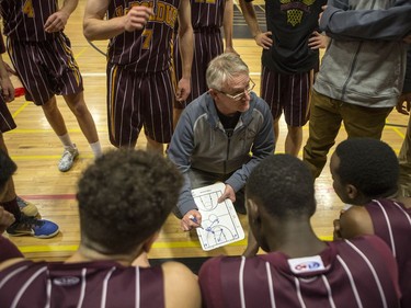 Dr. Martin Leboldus Suns coach Wade Bartlet speaks with his team between the first and second quarter as they take on The Bedford Road RedHawks in the opening game of the Bedford Road Invitational Tournament (BRIT) at Bedford Road Collegiate in Saskatoon, January 12, 2017.