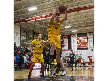 Dr. Martin Leboldus Suns forward Marcus Roflik grabs a rebound against the St. Francis Xavier Rams during their game in the Bedford Road Invitational Tournament (BRIT) at Bedford Road Collegiate in Saskatoon, January 13, 2017.