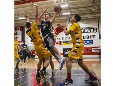 St. Francis Xavier Rams guard Liam Harrison drives the lane against the Dr. Martin Leboldus Suns during their game in the Bedford Road Invitational Tournament (BRIT) at Bedford Road Collegiate in Saskatoon, January 13, 2017.