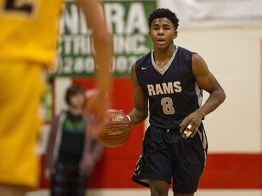 St. Francis Xavier Rams guard Geoffrey James moves the ball against the Dr. Martin Leboldus Suns during their game in the Bedford Road Invitational Tournament (BRIT) at Bedford Road Collegiate in Saskatoon, January 13, 2017.