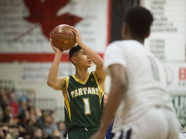 Campbell Collegiate Tartans gaurd Daniel Sison passes the ball to a teammate during the final game of the Bedford Road Invitational Tournament in Saskatoon, January 14, 2017.