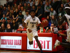 St. Francis Xavier guard Geoffrey James runs the ball down the court during Saturday night's BRIT victory.