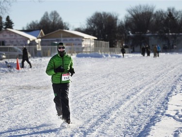 Greg Donaldson runs to the finish line during the 4x1 fun race at the Special Olympics Snow Shoe Tournament at E.D. Feehan High School in Saskatoon, January 14, 2017.