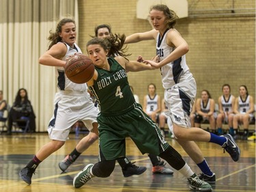 Holy Cross Crusaders' Samantha Revering changes direction with the ball against the Walter Murray Marauders  in high school girl's basketball action at Walter Murray Collegiate in Saskatoon, January 17, 2017.