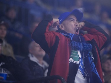 A Saskatoon Blades fan cheers during intermission as the Blades play the Brandon Wheat Kings at SaskTel Centre in Saskatoon, January 20, 2017.