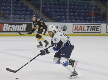 Saskatoon Blades forward Lukus MacKenzie takes the puck down the ice against the Brandon Wheat Kings at SaskTel Centre in Saskatoon, January 20, 2017.