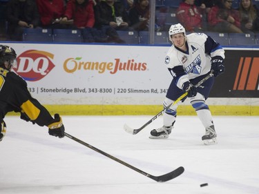 Saskatoon Blades defense Mark Rubinchik passes the puck to a fellow player during the game against the Brandon Wheat Kings at SaskTel Centre in Saskatoon, January 20, 2017.