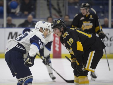 Saskatoon Blades forward Braylon Shmyr faces off against Brandon Wheat Kings' Nolan Patrick at SaskTel Centre in Saskatoon, January 20, 2017.