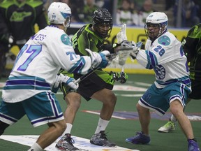 Saskatchewan defender Jeff Cornwall finds himself in heavy traffic during Saturday's win over Rochester.