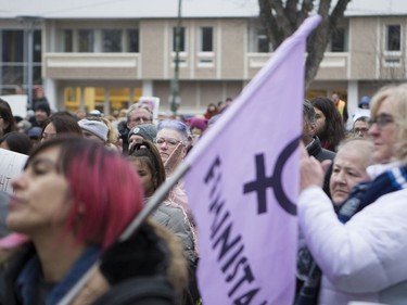 As a crowd gathers at City Hall in downtown Saskatoon, attendants clap during a speech before the march to raise awareness of women's rights, January 21, 2017.