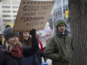 In solidarity with the women's march held in Washington D.C., a day after President Donald Trump's Inauguration, participants marched in downtown Saskatoon to support Women's Rights and speak out against Trump's politics on Saturday, Jan. 21, 2017.