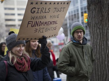 In solidarity with the women's march held in Washington D.C. a day after President Donald Trump's inauguration, marchers walk into Saskatoon's downtown core to support women's rights, January 21, 2017.