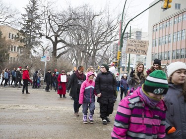 In solidarity with the women's march held in Washington D.C. a day after President Donald Trump's inauguration, marchers walk into Saskatoon's downtown core to support women's rights, January 21, 2017.