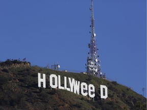The Hollywood sign is seen vandalized Sunday, Jan. 1, 2017. Los Angeles residents awoke New Year's Day to find a prankster had altered the famed Hollywood sign to read "HOLLYWeeD." Police have notified the city's Department of General Services, whose officers patrol Griffith Park and the area of the rugged Hollywood Hills near the sign. California voters in November approved Proposition 64, which legalized the recreational use of marijuana, beginning in 2018.