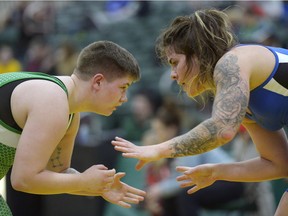 University of Saskatchewan wrestler Kiera Prior, left, takes on Cat-Town Wrestling Club wrestler Kristine Ursu wrestler Sofia Santora, bottom, during the Cougar Invitational wrestling meet held at the University of Regina, Sask. on Saturday Nov. 19, 2016. Ursu took the match on points. MICHAEL BELL