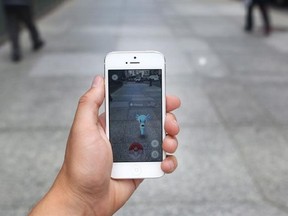 The national telecom regulator will look at ways to give parents more control over household cellphone data charges as part of a review of its four-year-old wireless code of conduct being held this week in Gatineau, Que. A Pokemon appears on a smartphone playing Pokemon Go, in Toronto in a July 19, 2016, file photo. THE CANADIAN PRESS/Cole Burston