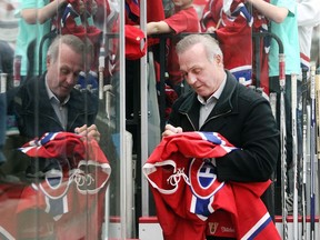 Guy Lafleur signs jerseys, hats and cards for an endless stream of autograph seekers before the Montreal Canadiens Alumni Tour game at Winsport on December 3, 2015. He was behind the bench for the Canadiens. (Ted Rhodes/Calgary Herald)
