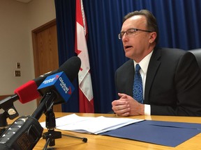 Health Minister Jim Reiter speaks to reporters Tuesday, February 7 in Saskatoon. Jonathan Charlton photo