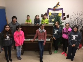 Olena Sviatenko, bottom centre, moved to Cumberland House in 2016 and now teaches piano to students at Charlebois Community School. Provided photo.