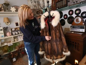 Super Thrift business owner at 33rd street market with a handmade beaver and fox fur jacket in Saskatoon on February 13, 2017. (Michelle Berg / Saskatoon StarPhoenix)