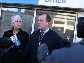 NDP finance critic Cathy Sproule and NDP Leader Trent Wotherspoon speak during a media scrum outside the Saskatoon cabinet office on Feb. 27, 2017