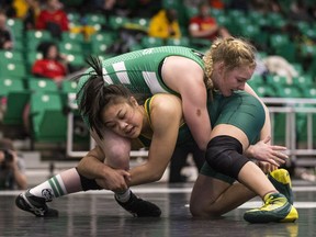 University of Saskatchewan Laryssa Barry, left, takes on University of Regina Chantel Pasion in the 59kg weight class during the Canada West Wrestling Championships at the PAC on the U of S campus in Saskatoon, SK on Friday, February 10, 2017.