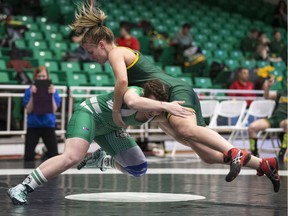 University of Saskatchewan Huskies' Dalyn McKay (R) takes on University of Regina Cougars' Alison Mcphee in the 67kg weight class during the CanWest Wrestling Championships at the PAC on the U of S campus in Saskatoon, February 10, 2017.