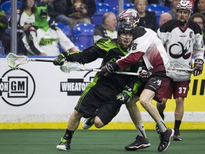 Saskatchewan Rush defender Mike Messenger runs the ball past Colorado's Robert Hope Saturday night at SaskTel Centre.