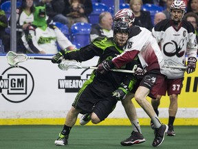 Saskatchewan's Mike Messenger finds the going tough against Colorado's Robert Hope during regular-season action in February. The teams will meet Saturday in Saskatoon, with a trip to the NLL finals on the line.