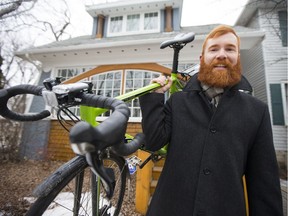 Brodie Thompson, a board member of Saskatoon Cycle, poses with his bike in front of his home in Saskatoon, SK on Wednesday, February 22, 2017.