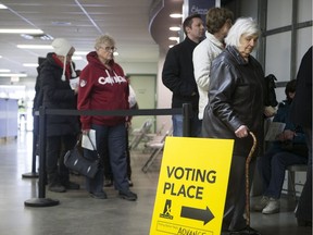 Voters stand in line to cast ballots in the Saskatoon Meewasin by-election in February 2017.