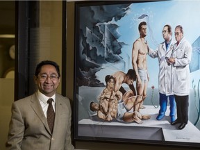Dr. Jose Tellez-Zenteno, who established and leads Saskatchewan's only dedicated epilepsy unit, stands for a photograph with a painting he commissioned at Royal University Hospital