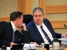 Coun. Troy Davies, left, voted to restore Saskatoon city council members' ability to claim tickets to events as an expense, while Coun. Randy Donauer voted against the motion Monday at city council. (GREG PENDER/The StarPhoenix)