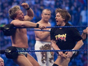 WWE star Chris Jericho gets pummeled on the ropes by "Rowdy" Roddy Piper at WrestleMania 25 at Reliant Stadium on April 5, 2009 in Houston, Texas
