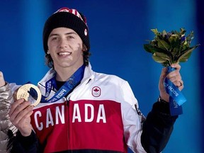 Canada&#039;s Mark McMorris receives his bronze medal for snowboard slopestyle at the medal ceremonies during the 2014 Sochi Winter Olympics in Sochi, Russia on Saturday, February 8, 2014. Despite being in hospital with serious injuries suffered in a backcountry accident over the weekend, snowboard star McMorris was provisionally nominated to Canada&#039;s team for the 2018 Winter Olympics on Tuesday. THE CANADIAN PRESS/Nathan Denette