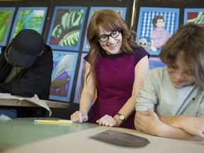 Diana Panton instructs a class of grade 9 French Immersion students during an art class at Westdale Secondary School in Hamilton, Ont., on Thursday, March 23, 2017. Panton is a previous Juno Award winner for best jazz album and is nominated again this year for a children&#039;s jazz album. THE CANADIAN PRESS/Peter Power