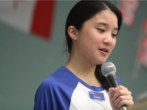 Asya Dinh, a member of the Saskatoon Public School Division's iGen program, reads a story about an elder at the Sherbrooke Community Centre on Wednesday March 29, 2017 as part of an event celebrating Canada's 150th birthday. Organizers say the event was a chance to capture a pieces of history from the local community in hopes of compiling them into a book to preserve them for another 150 years. (Morgan Modjeski/the Saskatoon StarPhoenix)
