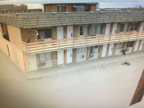Court exhibit photo of the parking lot at the Northwoods Inn motel in Saskatoon where 44-year-old Billy Johnston was involved in an altercation before he was fatally stabbed just beyond the corner of the building on April 18, 2015.