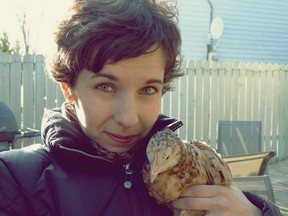 Jamie Shebelski, who had a backyard chicken coop in Saskatoon illegally, poses for a photo with a chicken she kept at her Saskatoon home. Never having more than four hens in her coop, she says concerns about noise and odours as a result of small backyard coops are overblown, saying for her, her dogs were more of a nuisance.